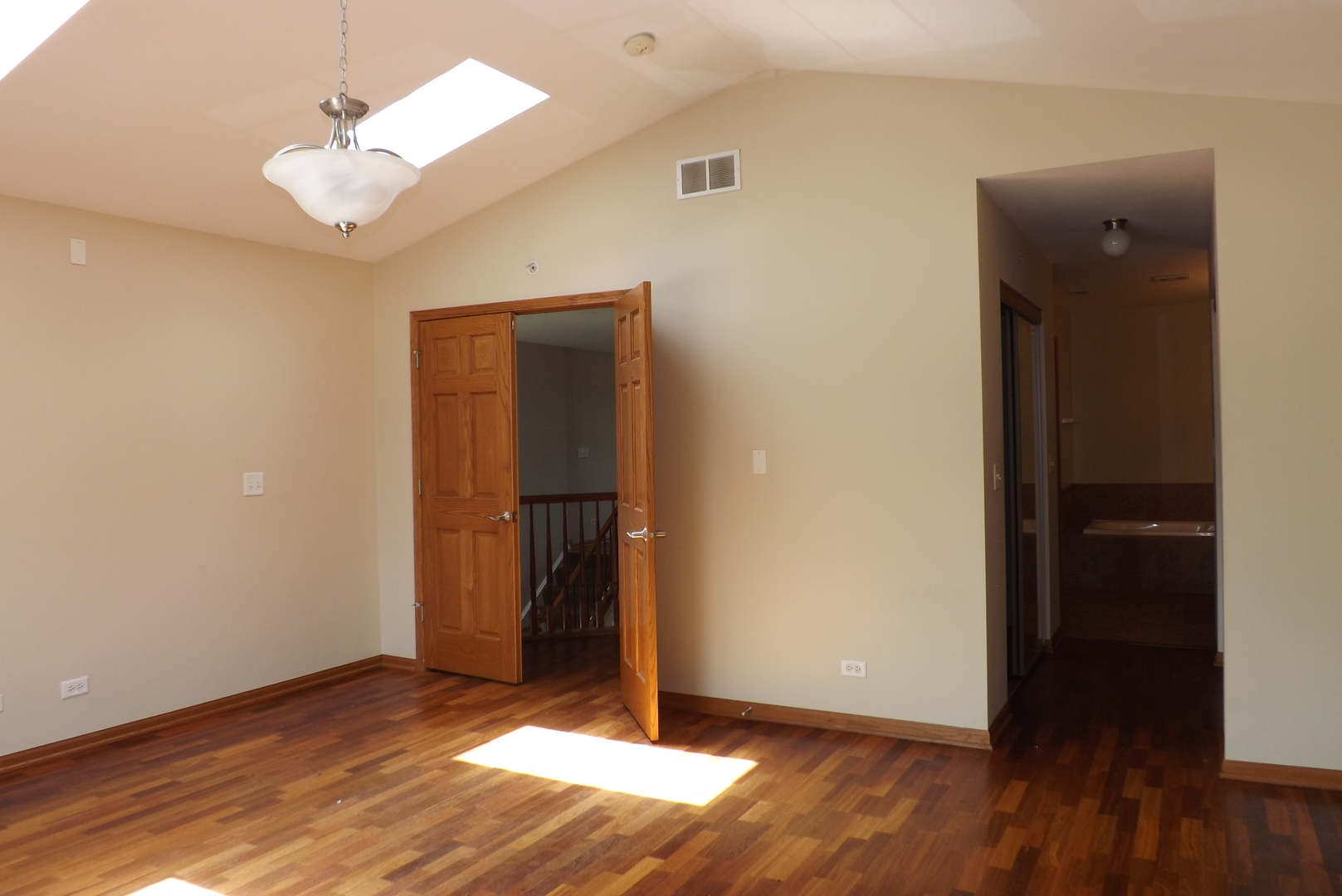 21130 Gray Hawk Drive Matteson, IL 60443 - Photo 13 of 14 an empty room with wooden floor and cabinet