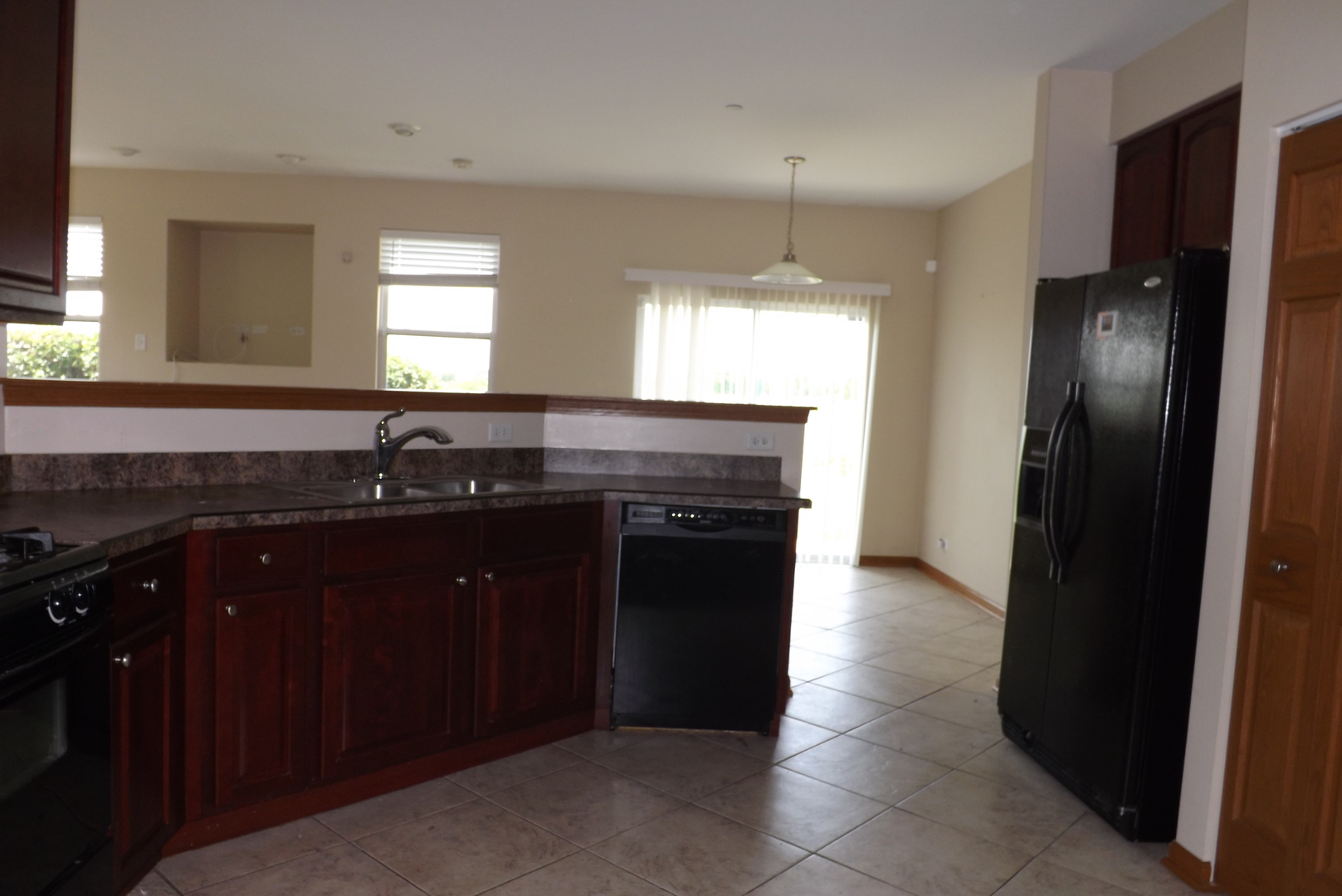 21130 Gray Hawk Drive Matteson, IL 60443 - Photo 6 of 14 a kitchen with a sink and a refrigerator