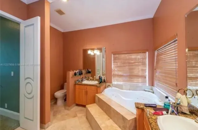 a spacious bathroom with sink shower and bathtub