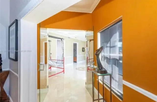 a view of a livingroom with furniture and a ceiling fan