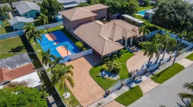an aerial view of a house with a garden