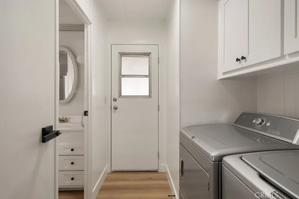a utility room with closet dryer and washer