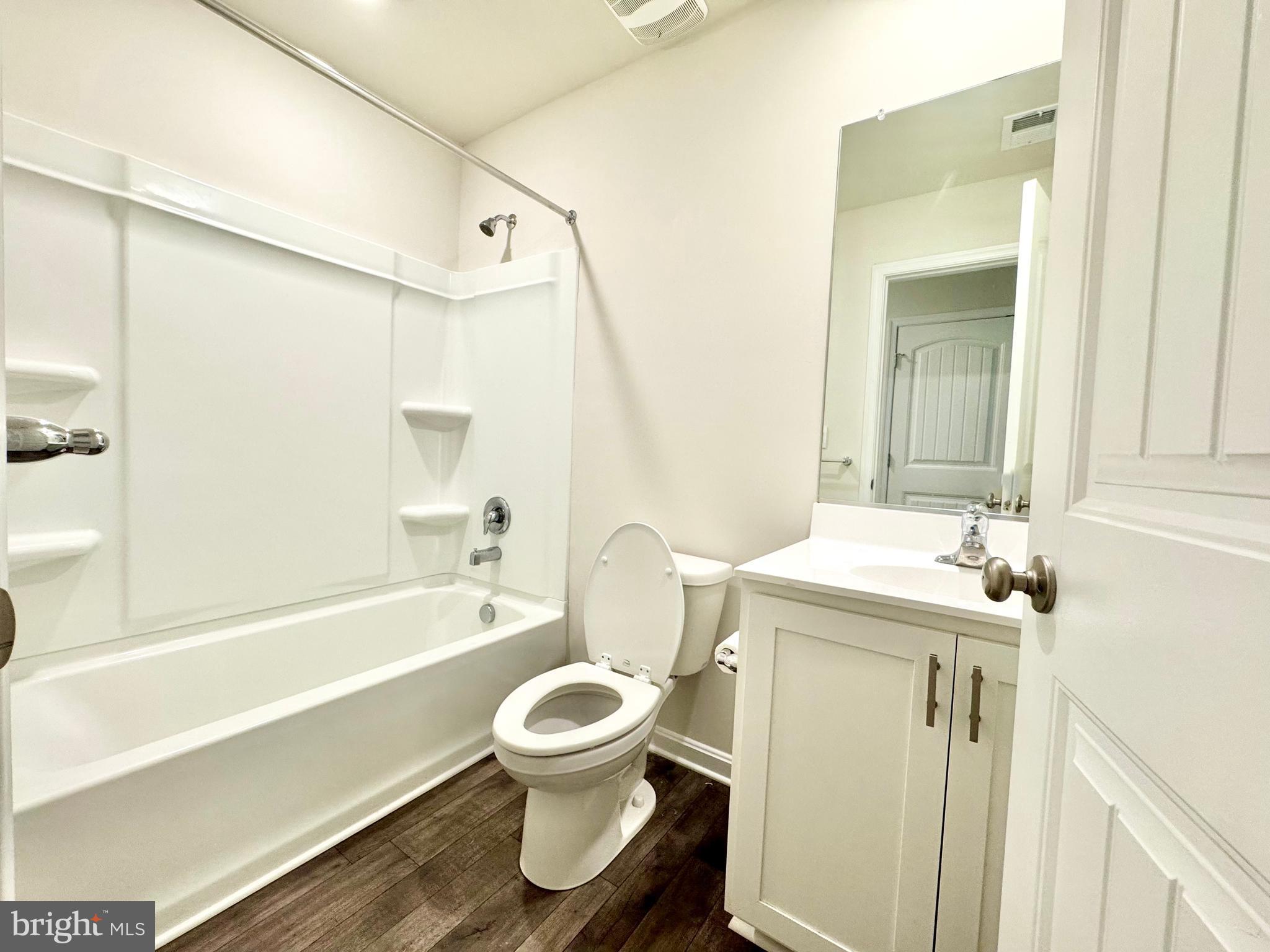 198 Currant Circle Magnolia, DE 19962 - Photo 12 of 19 a bathroom with a sink toilet and shower