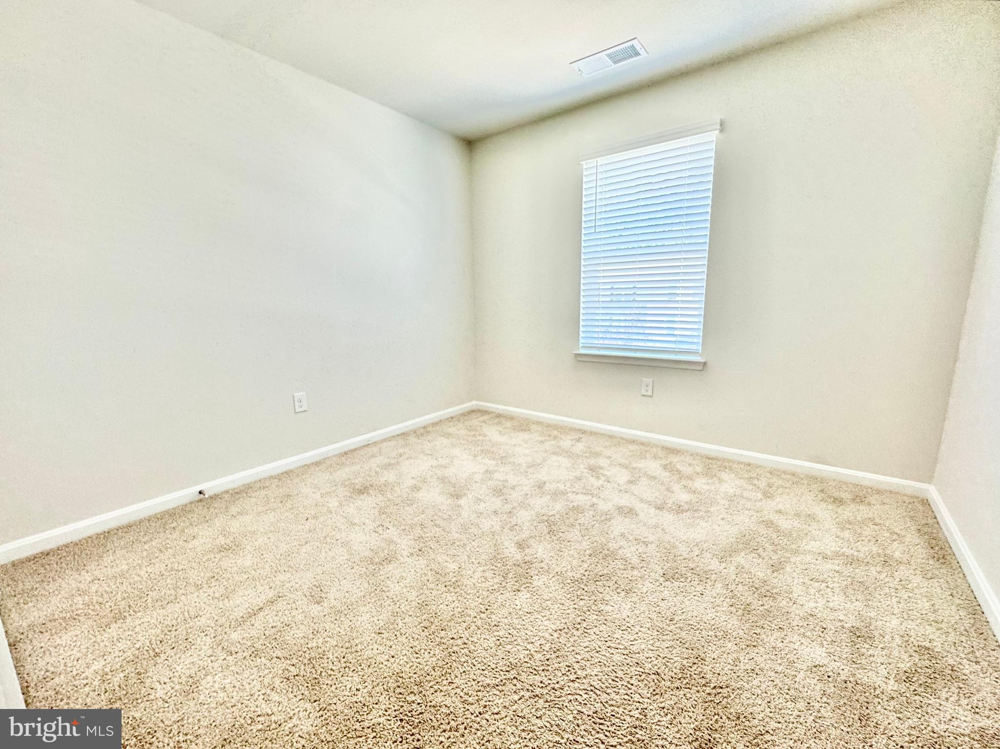 198 Currant Circle Magnolia, DE 19962 - Photo 16 of 19 an empty room with a exposed radiator