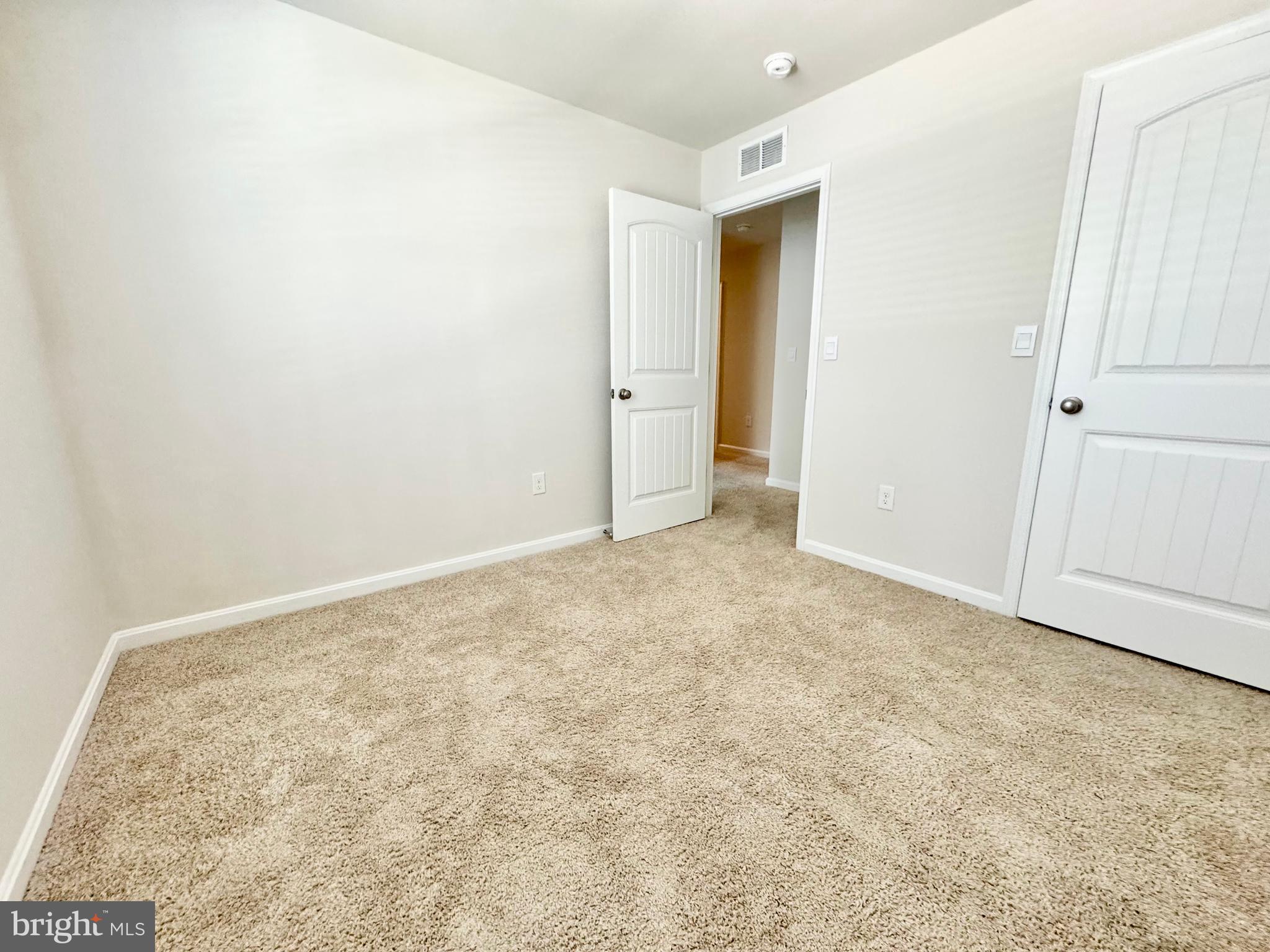 198 Currant Circle Magnolia, DE 19962 - Photo 17 of 19 an empty room with an entryway