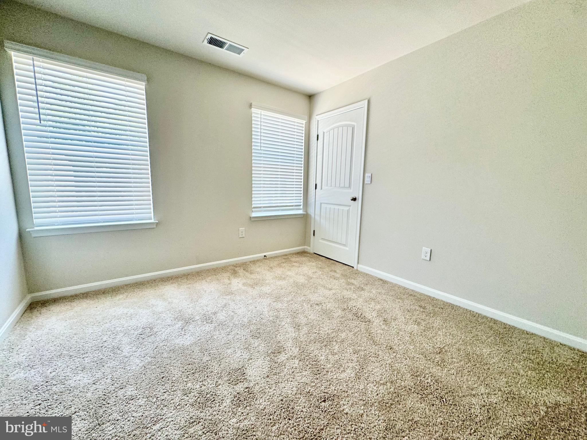 198 Currant Circle Magnolia, DE 19962 - Photo 18 of 19 an empty room with a natural light
