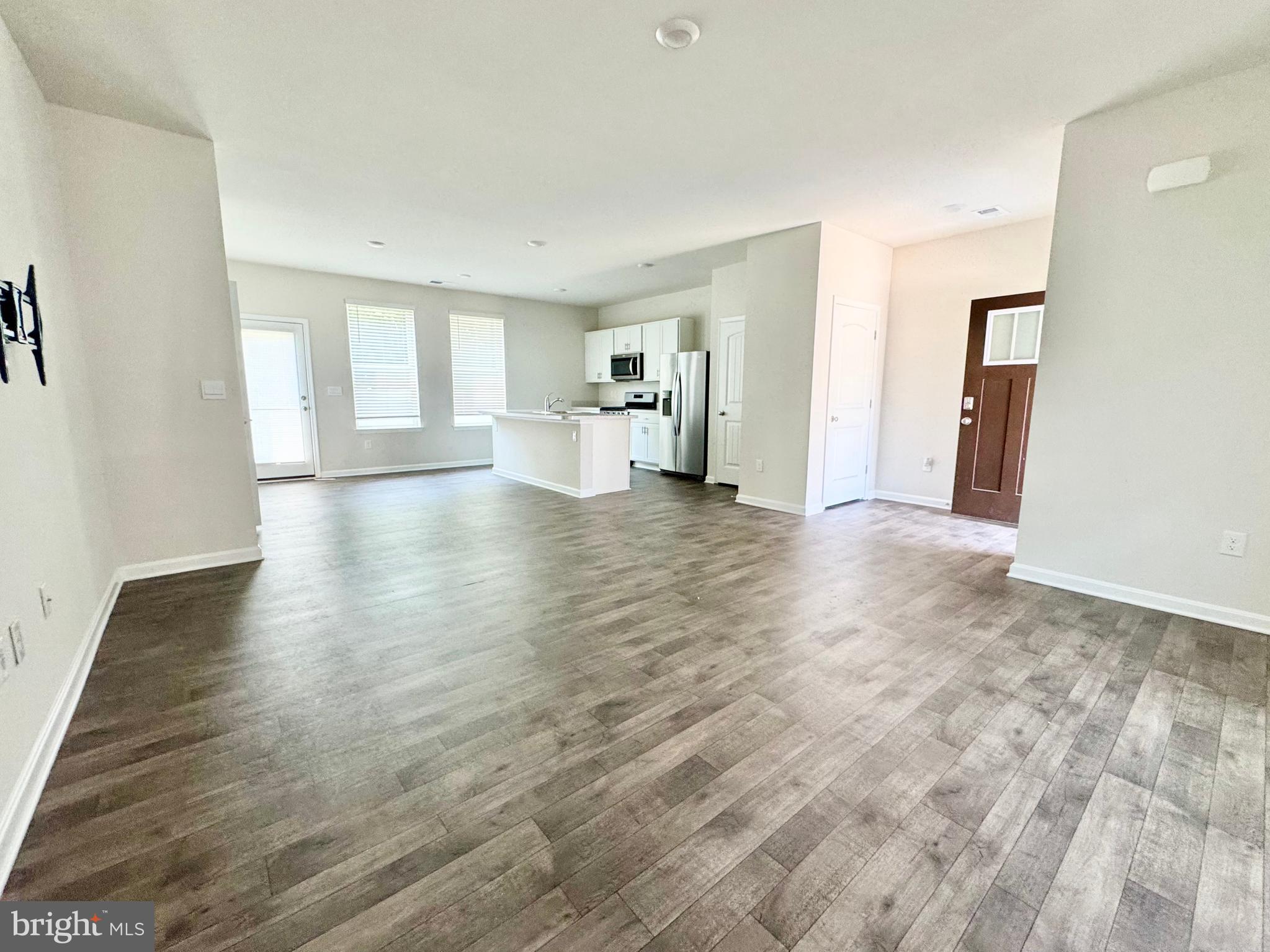 198 Currant Circle Magnolia, DE 19962 - Photo 5 of 19 a view of a livingroom with wooden floor and a window