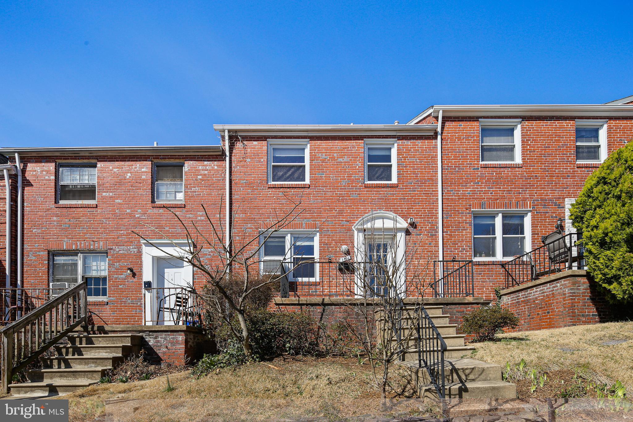 3812 Rexmere Road Baltimore, MD 21218 - Photo 1 of 35 a front view of a house with garden