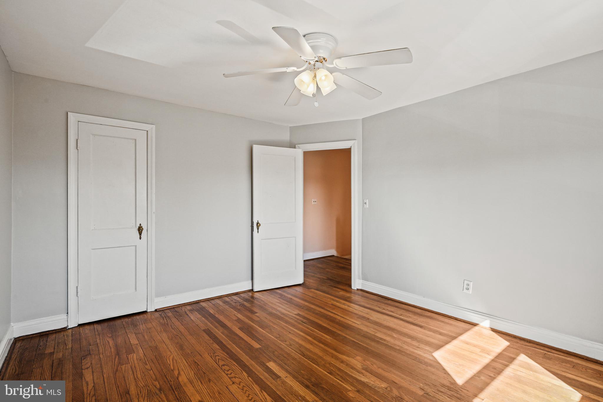 3812 Rexmere Road Baltimore, MD 21218 - Photo 13 of 35 a view of an empty room with wooden floor