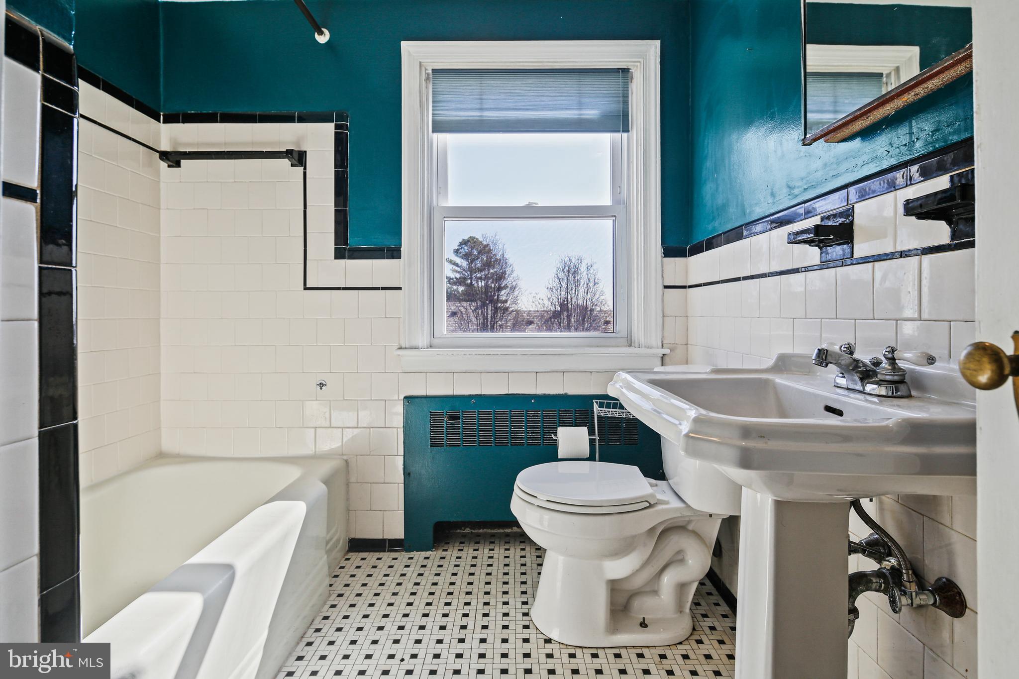 3812 Rexmere Road Baltimore, MD 21218 - Photo 15 of 35 a bathroom with a sink toilet and shower