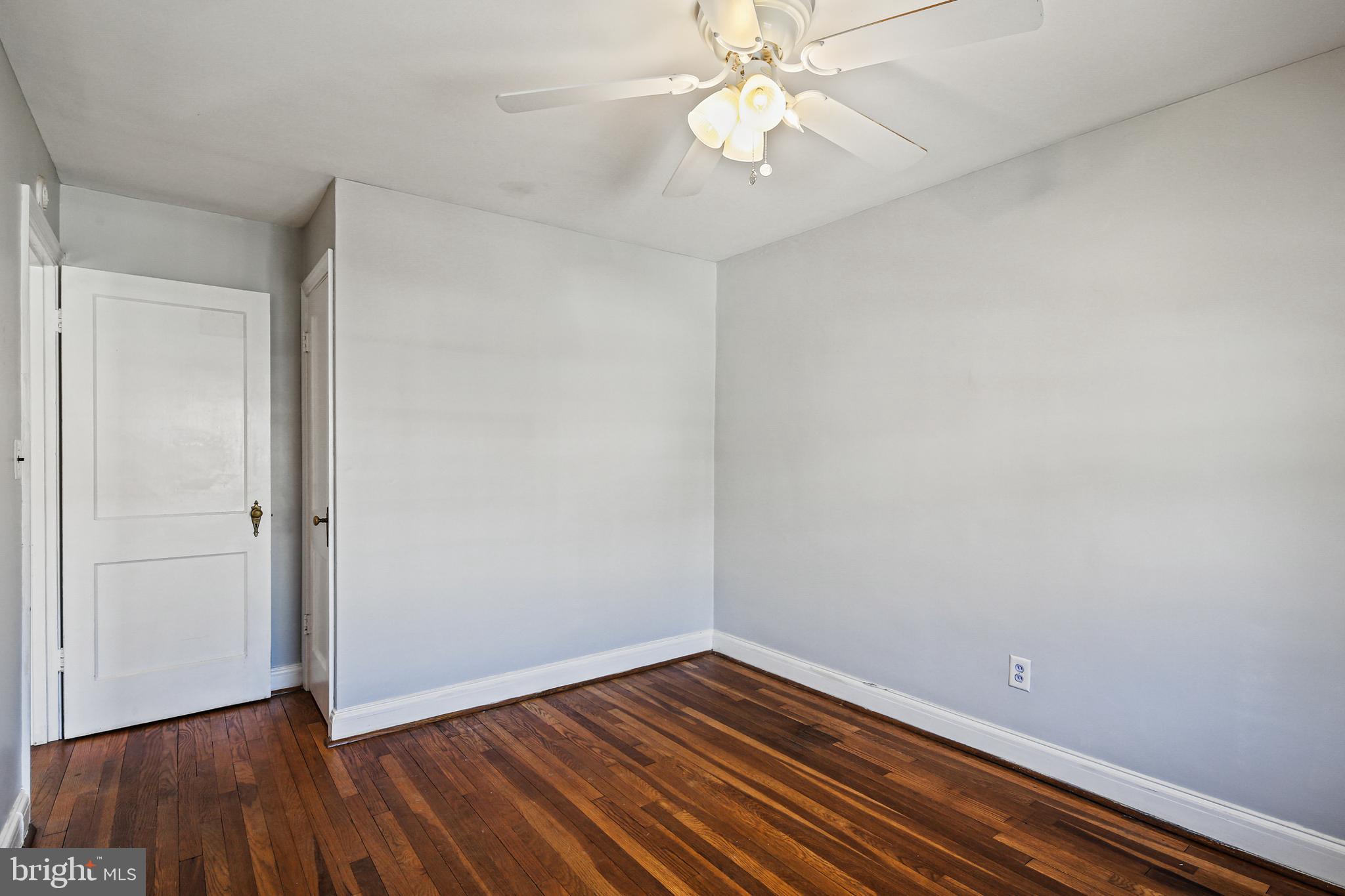 3812 Rexmere Road Baltimore, MD 21218 - Photo 17 of 35 a view of an empty room with wooden floor