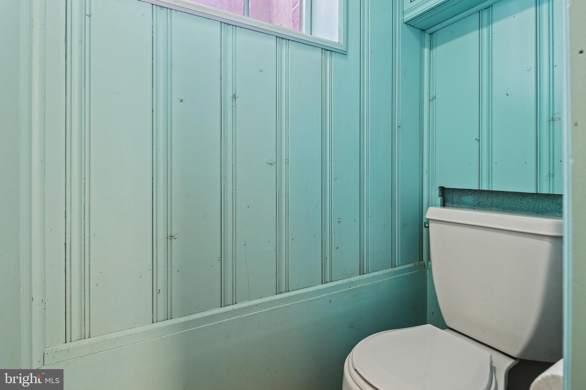 3812 Rexmere Road Baltimore, MD 21218 - Photo 28 of 35 a white toilet sitting next to a shower