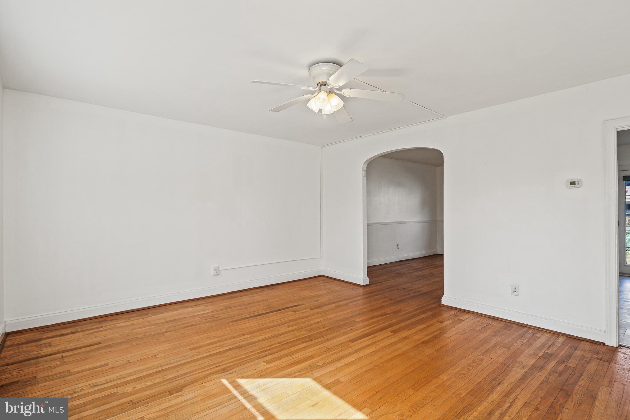 3812 Rexmere Road Baltimore, MD 21218 - Photo 4 of 35 wooden floor in an empty room