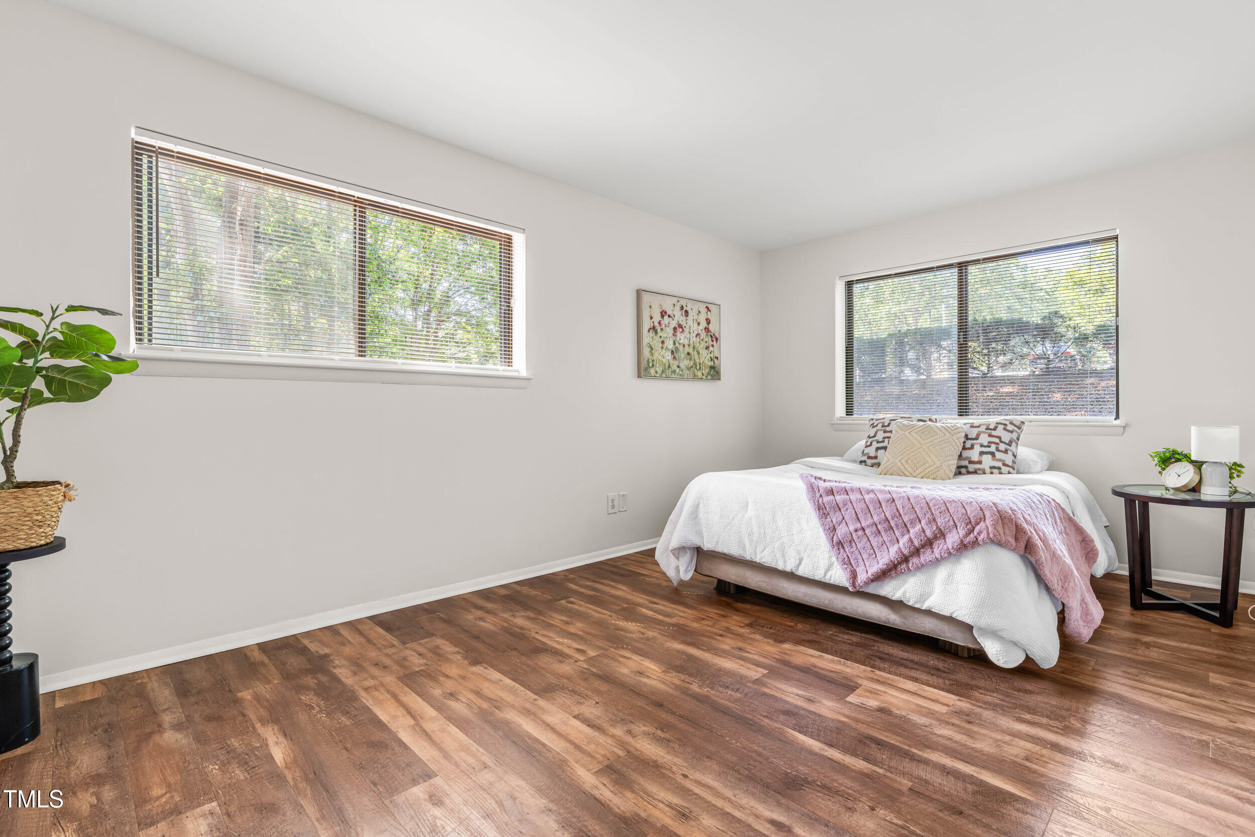1212 Schaub Drive, Unit C Raleigh, NC 27606 - Photo 5 of 23 a bedroom with a bed and a window