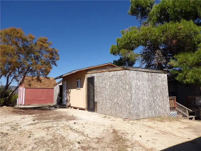 a view of a house with a snow in the yard