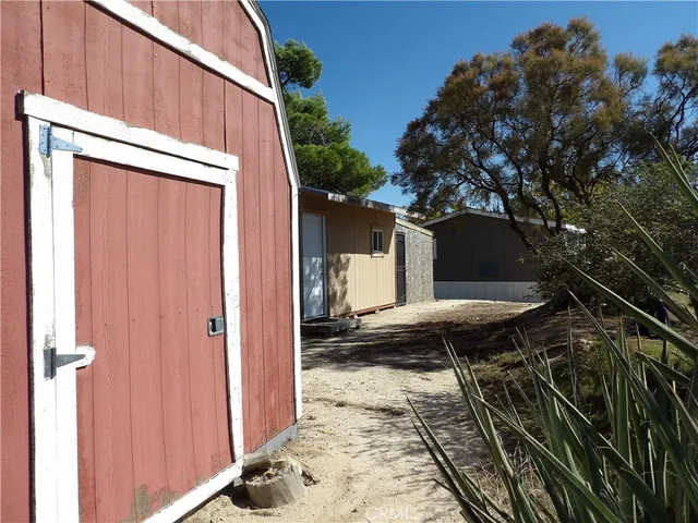 a view of a city with lush green forest