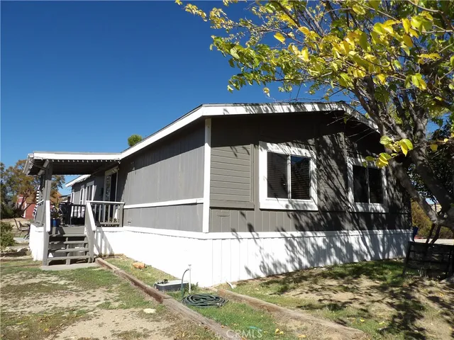 a view of house with swimming pool