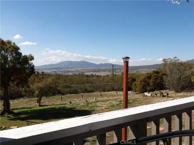 a view of a road with a building in the background