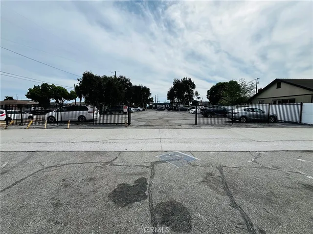 a view of street with parked cars