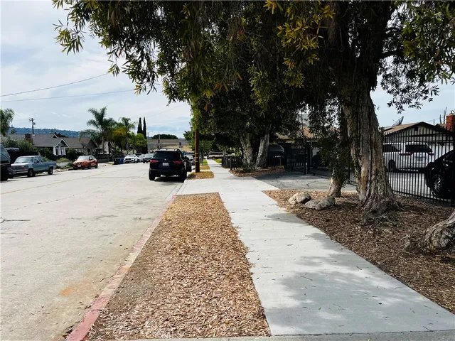 a view of a street with cars