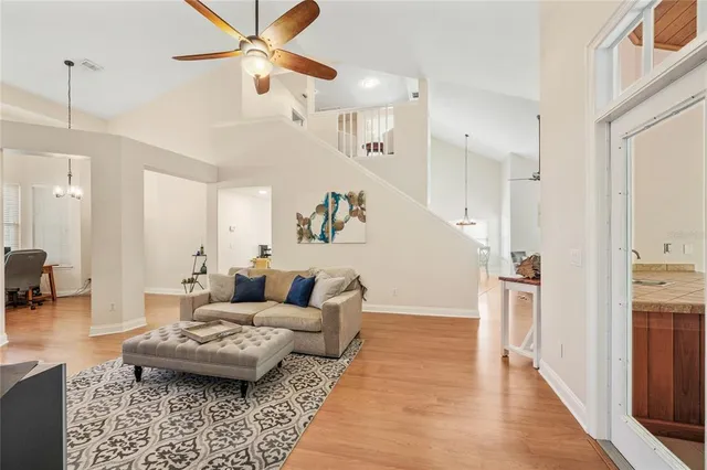 a kitchen with stainless steel appliances granite countertop a sink a stove and refrigerator