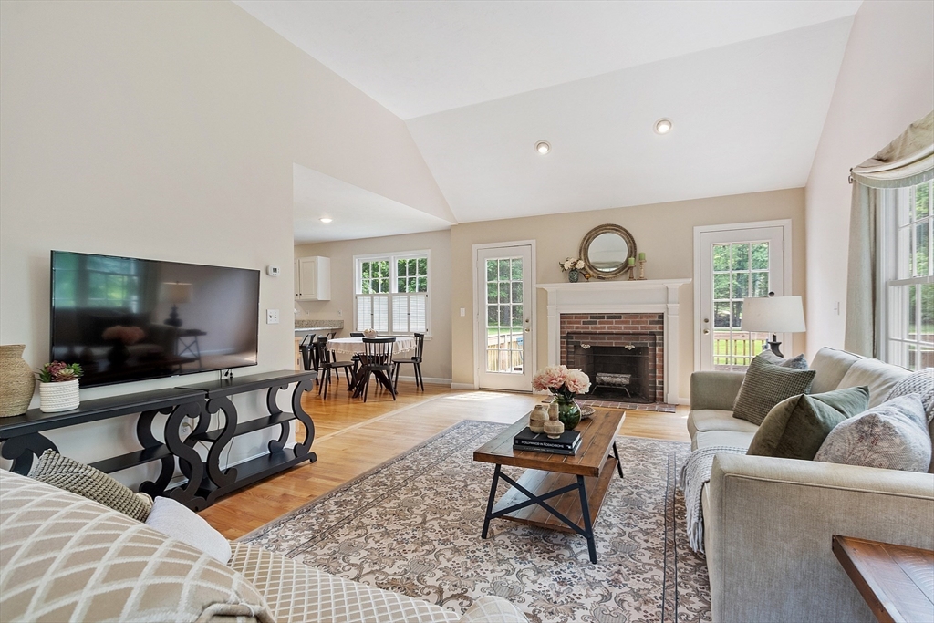 28 Old Harvard Road Boxborough, MA 01719 - Photo 13 of 40 a living room with furniture and a flat screen tv