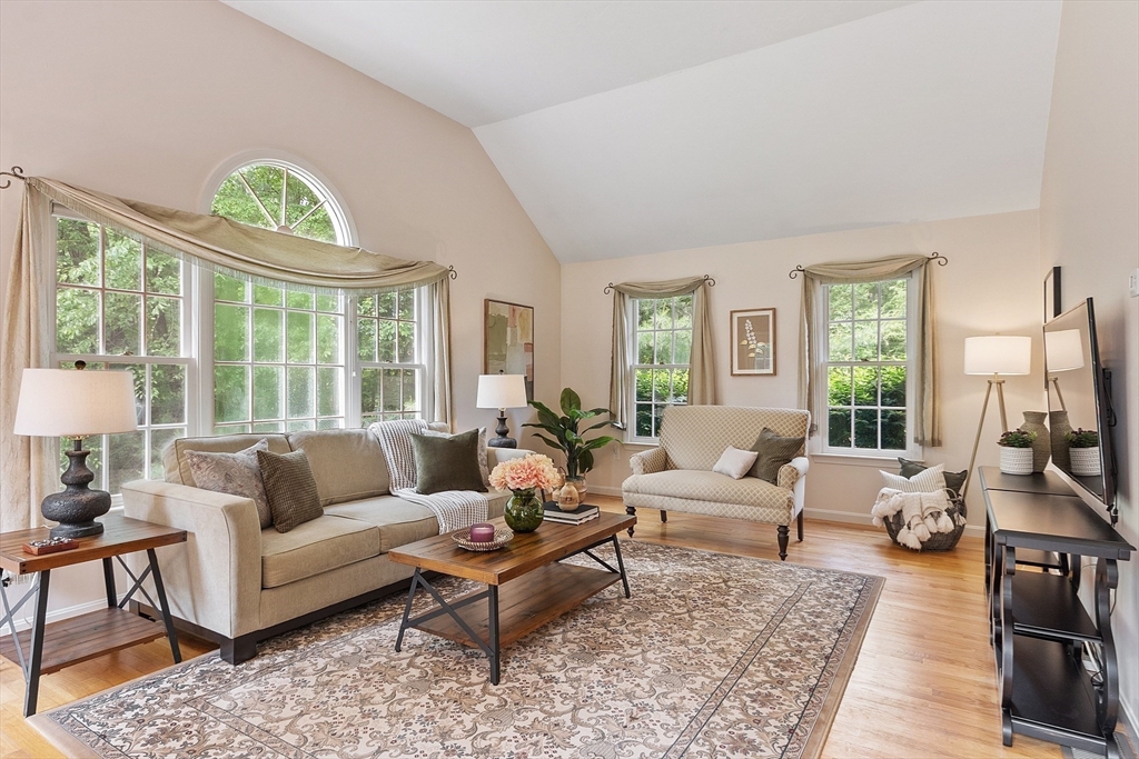28 Old Harvard Road Boxborough, MA 01719 - Photo 14 of 40 a living room with furniture a rug a lamp and a large window