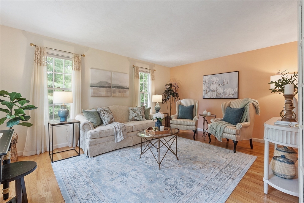 28 Old Harvard Road Boxborough, MA 01719 - Photo 17 of 40 a living room with furniture wooden floor and a large window