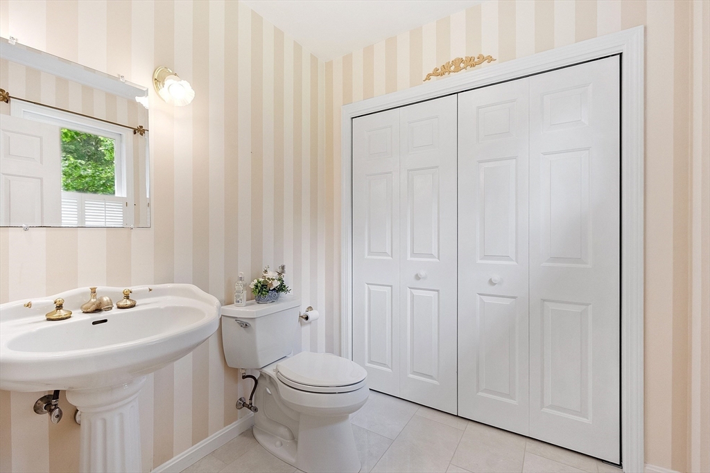 28 Old Harvard Road Boxborough, MA 01719 - Photo 19 of 40 a bathroom with a sink a toilet and shower curtain