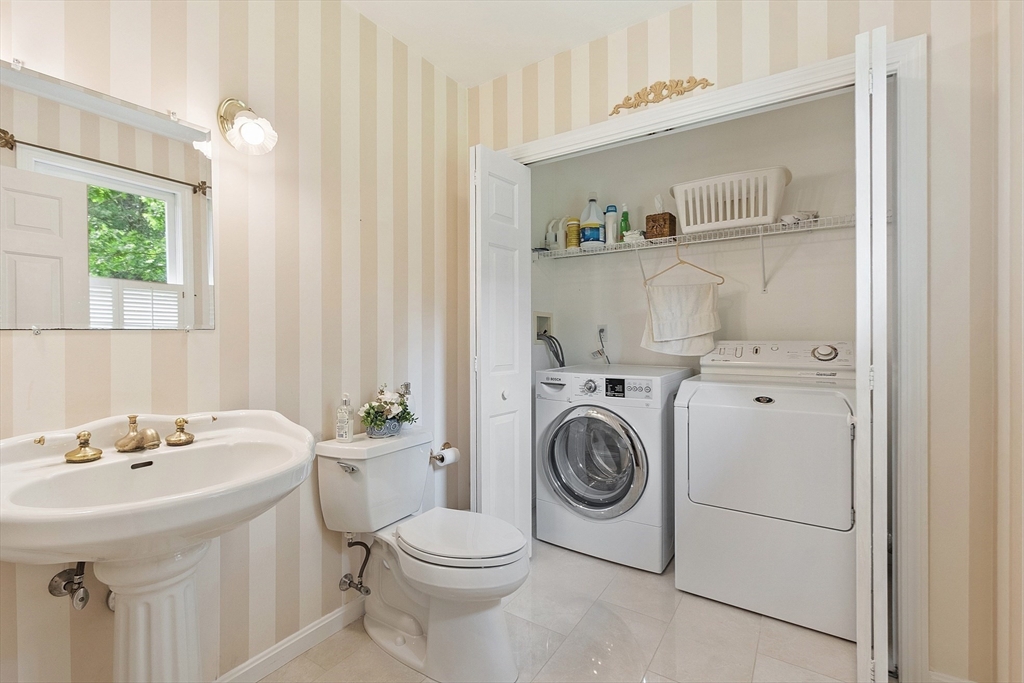 28 Old Harvard Road Boxborough, MA 01719 - Photo 20 of 40 a bathroom with a sink a toilet and a window