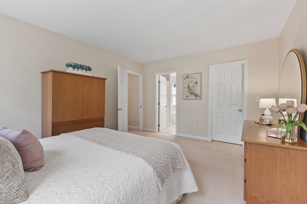 28 Old Harvard Road Boxborough, MA 01719 - Photo 23 of 40 a bedroom with a bed and a dresser