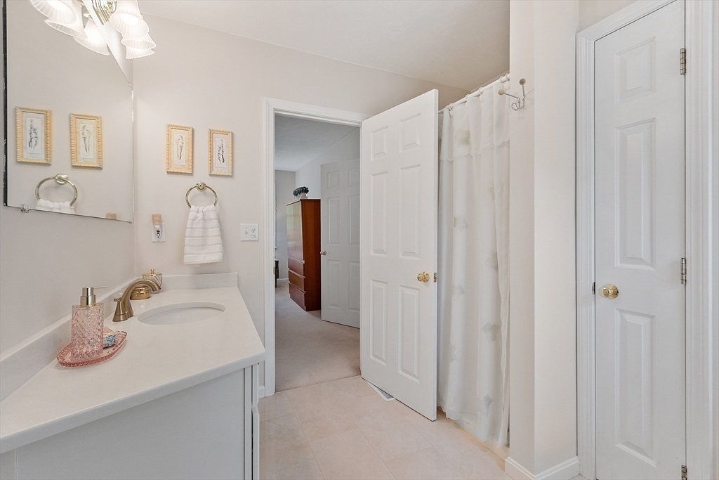 28 Old Harvard Road Boxborough, MA 01719 - Photo 25 of 40 a bathroom with a sink and a mirror