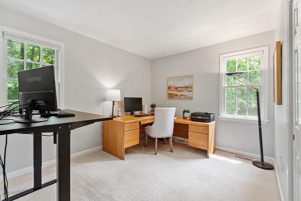 28 Old Harvard Road Boxborough, MA 01719 - Photo 30 of 40 a view of a workspace with furniture and a window