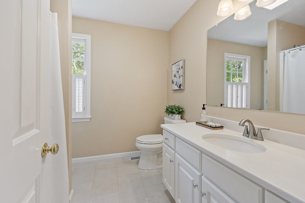 28 Old Harvard Road Boxborough, MA 01719 - Photo 33 of 40 a bathroom with a sink toilet and vanity