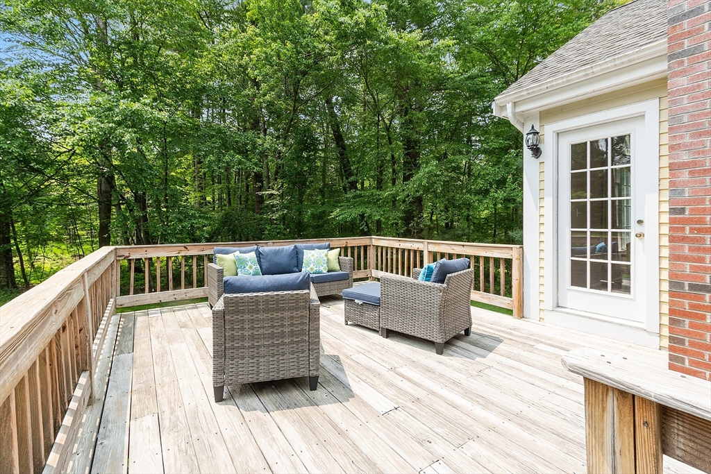 28 Old Harvard Road Boxborough, MA 01719 - Photo 35 of 40 a view of a deck with couches and wooden floor