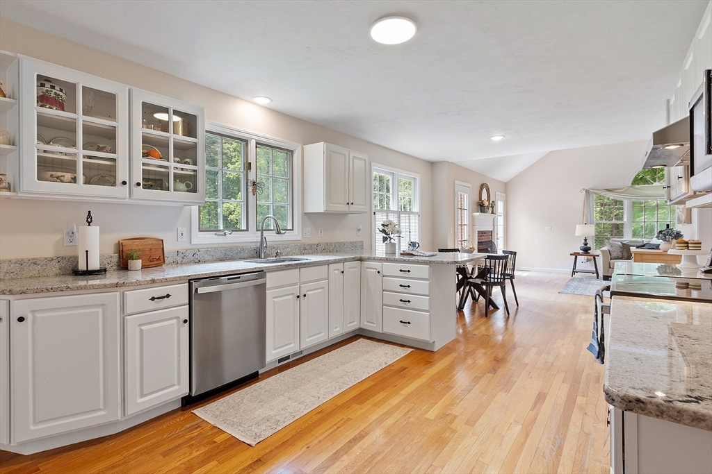 28 Old Harvard Road Boxborough, MA 01719 - Photo 7 of 40 a kitchen with lots of counter top space and dining table