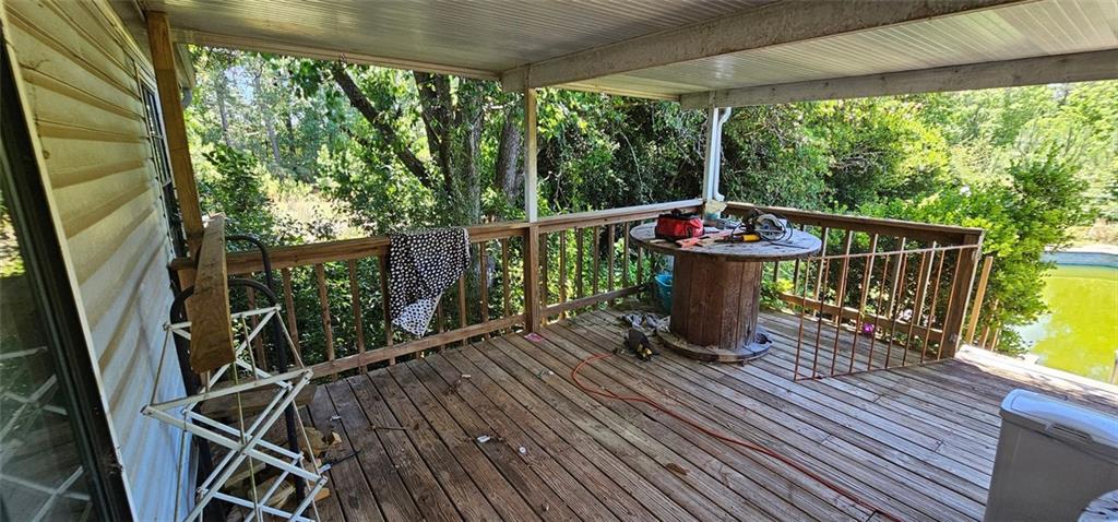 944 Lite-N-Tie Road Macon, GA 31211 - Photo 35 of 36 a view of a balcony with chairs and wooden floor