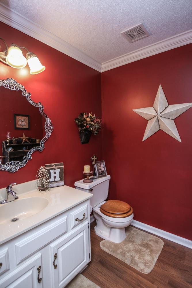 4150 Murfreesboro Road Lebanon, TN 37090 - Photo 8 of 30 a bathroom with a toilet a sink and mirror