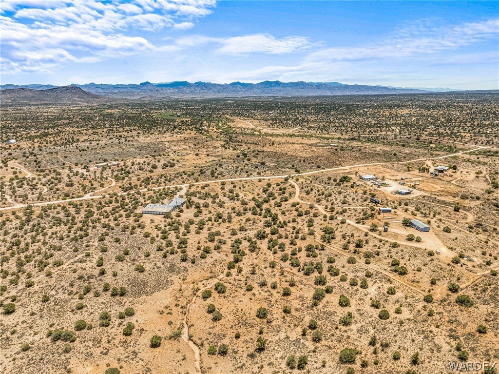 2401 North Stephan Road Kingman, AZ 86401 - Photo 4 of 92 Expansive desert landscape featuring scattered vegetation and distant mountain ranges