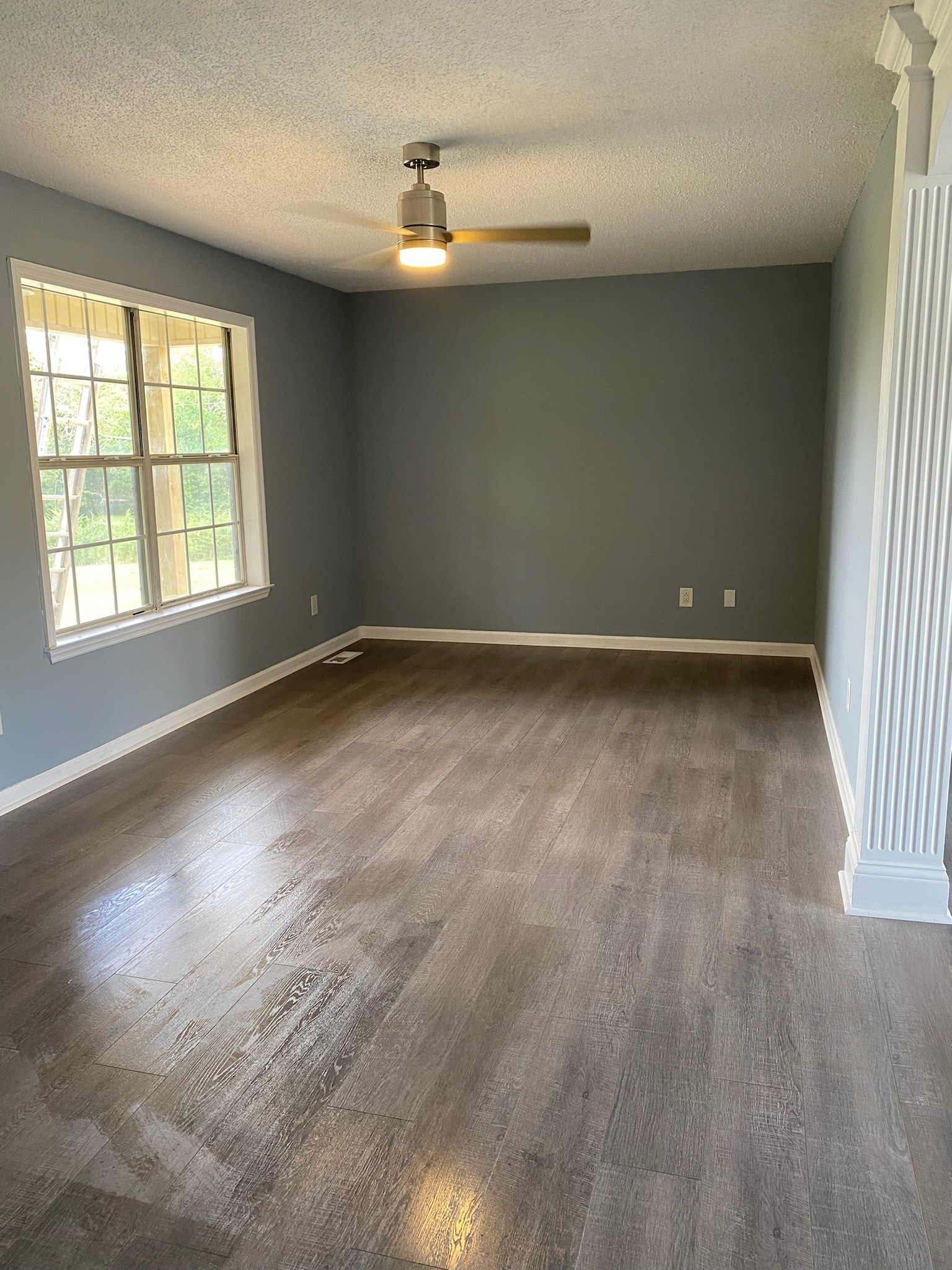 4370 Hardison Mill Road Columbia, TN 38401 - Photo 15 of 37 an empty room with wooden floor and windows