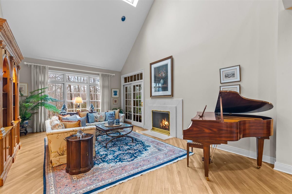 852 Gloucester Crossing Lake Forest, IL 60045 - Photo 5 of 29 a living room with furniture and a fireplace