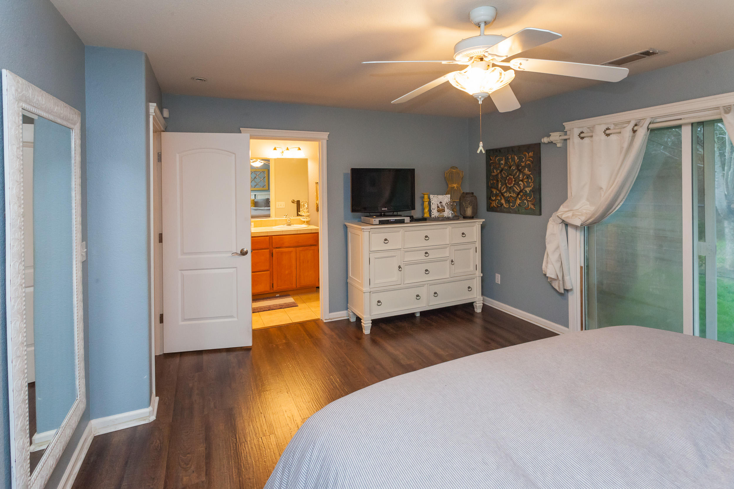 7740 Pit Road Redding, CA 96001 - Photo 16 of 23 a bedroom with a bed and a flat screen tv