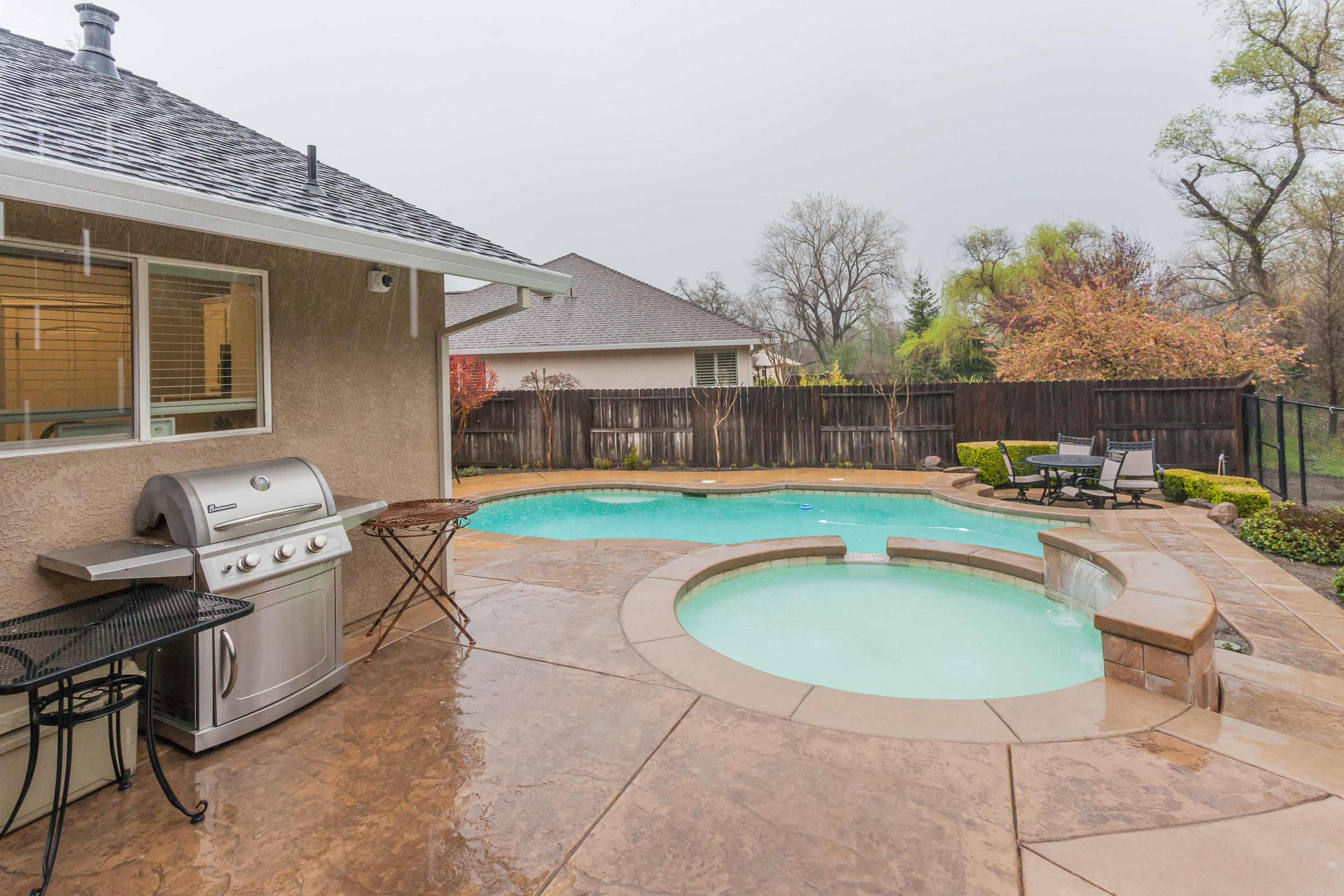 7740 Pit Road Redding, CA 96001 - Photo 19 of 23 a swimming pool with outdoor seating yard and barbeque oven