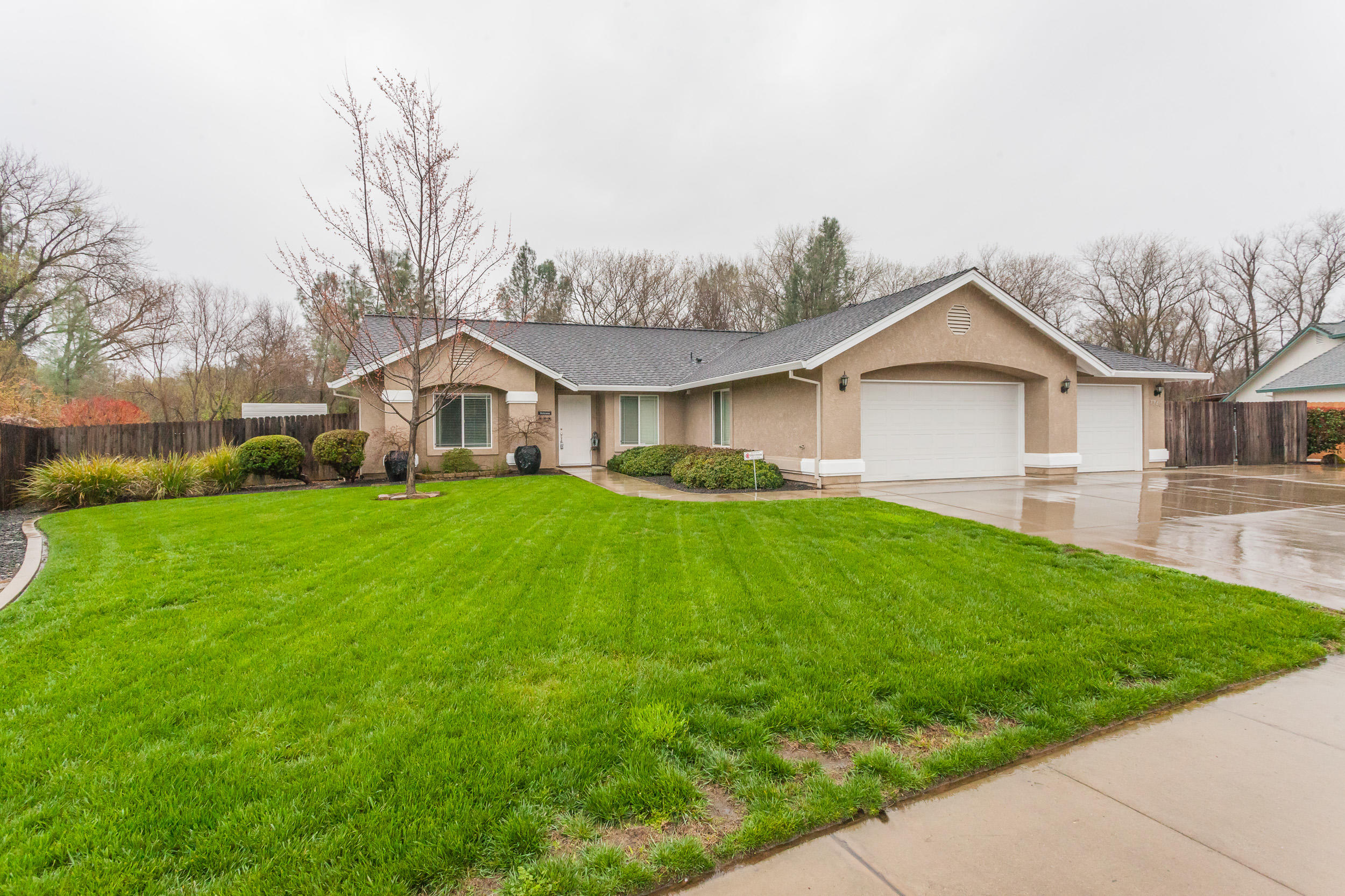 7740 Pit Road Redding, CA 96001 - Photo 2 of 23 a front view of house with yard and green space