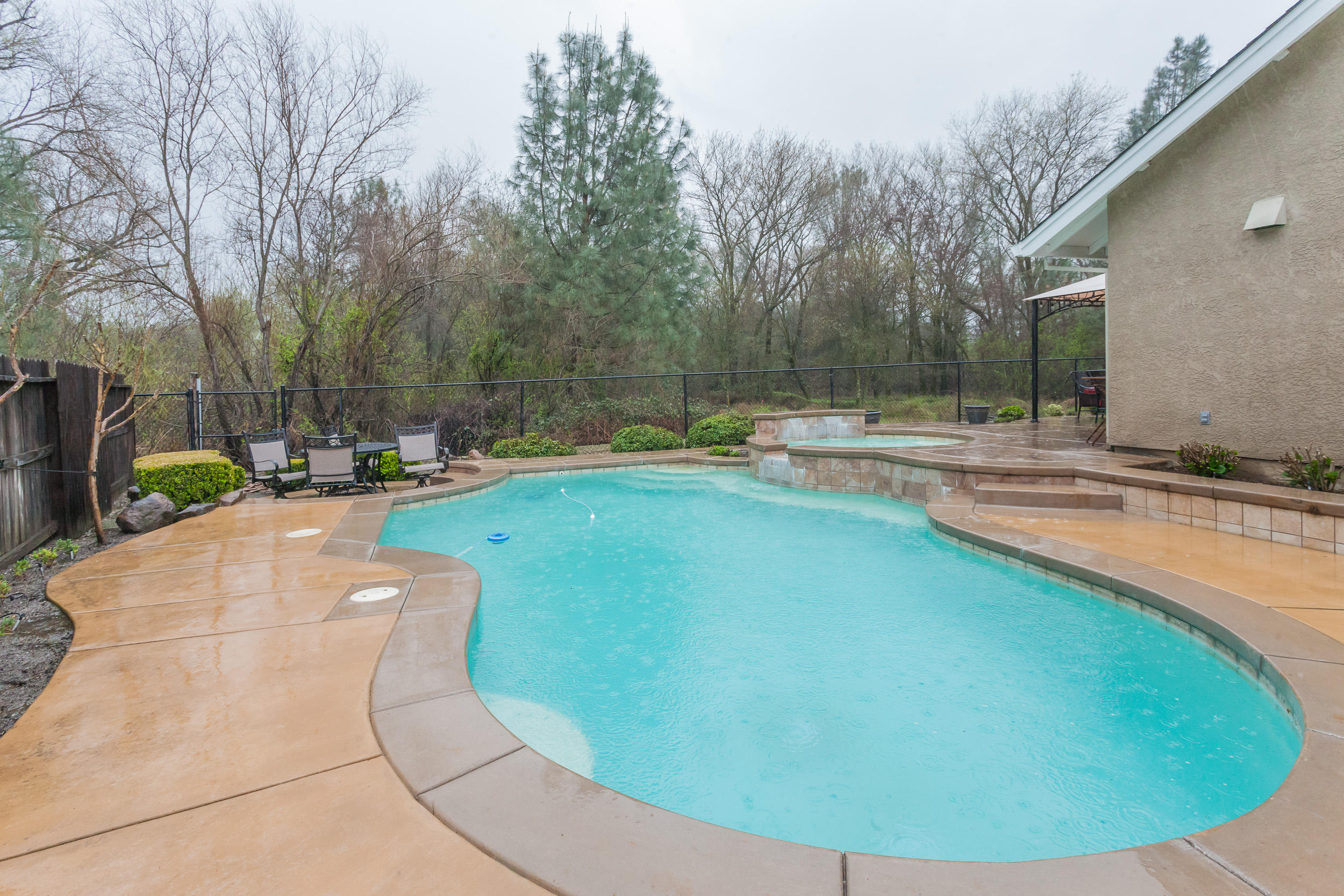 7740 Pit Road Redding, CA 96001 - Photo 21 of 23 a view of a swimming pool with a yard