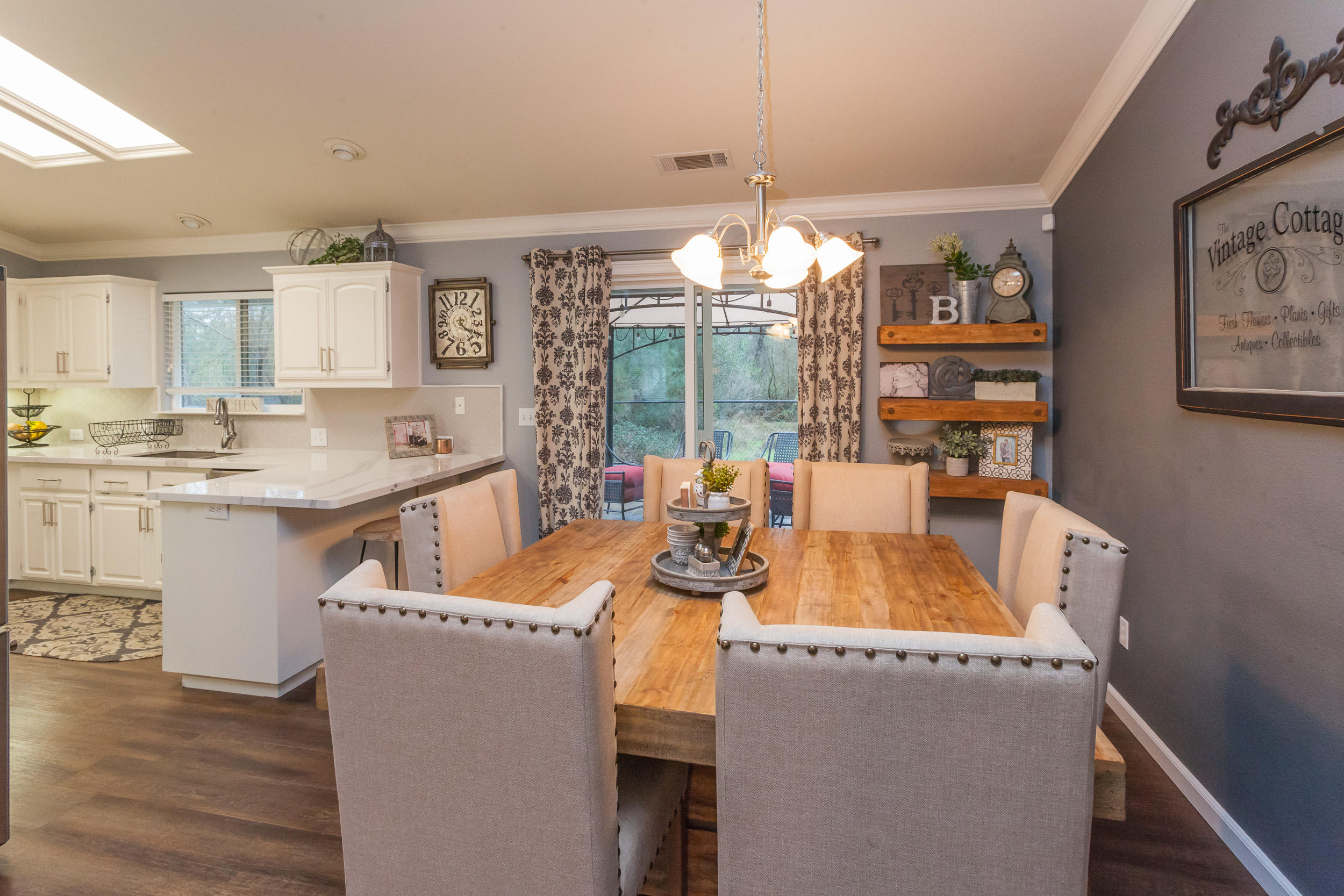 7740 Pit Road Redding, CA 96001 - Photo 9 of 23 a view of a dining room with furniture wooden floor and chandelier