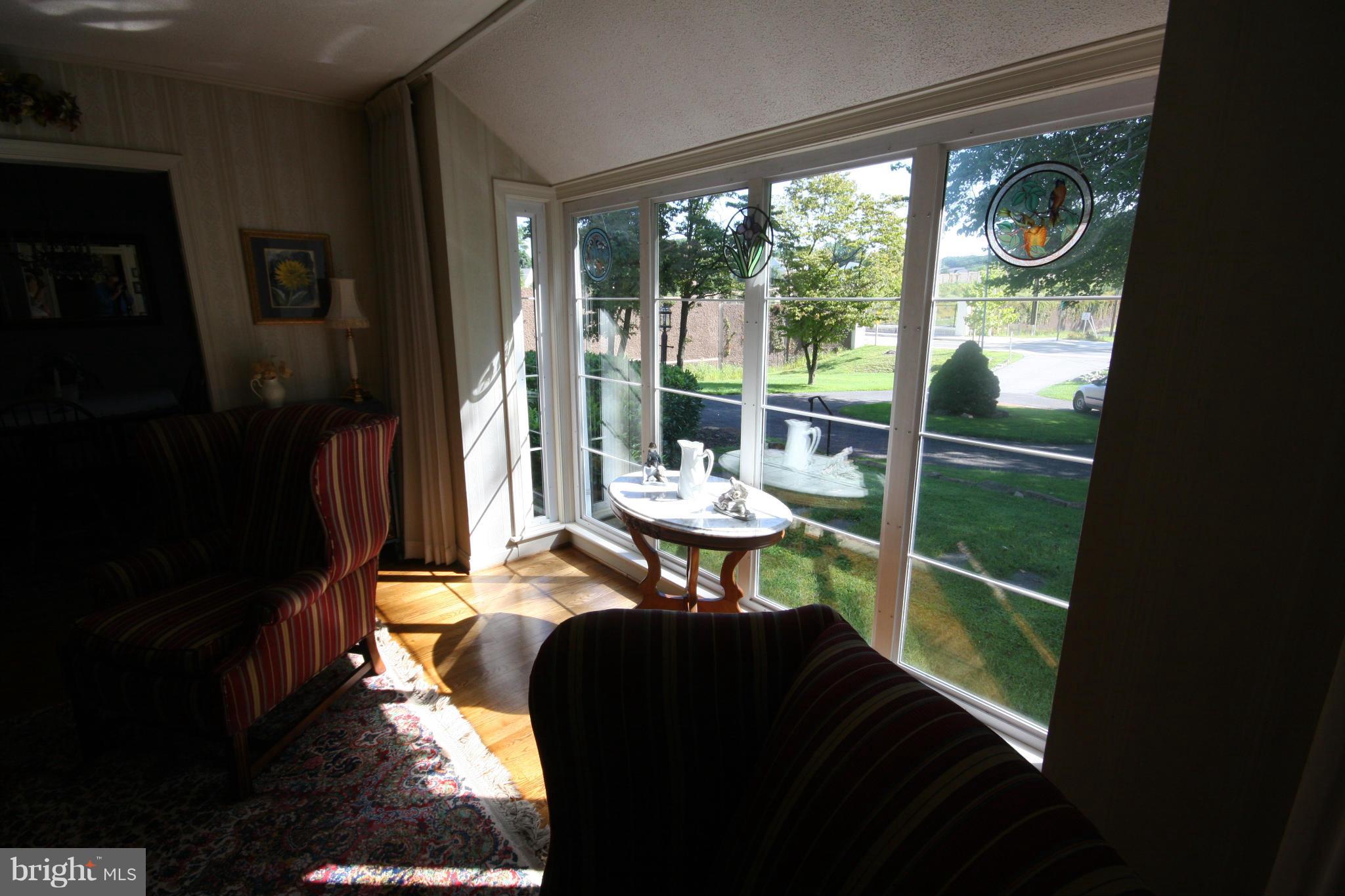 14014 Notley Road Silver Spring, MD 20904 - Photo 11 of 30 a living room with a table and a potted plant