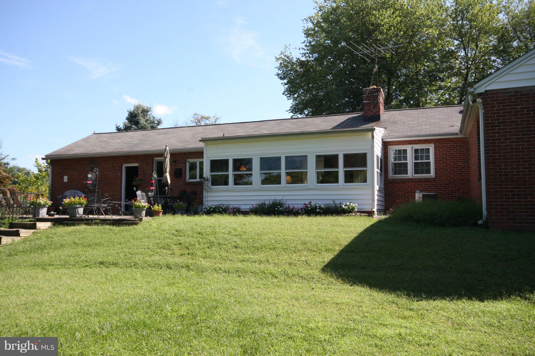 14014 Notley Road Silver Spring, MD 20904 - Photo 9 of 30 a view of a house with a yard and sitting area