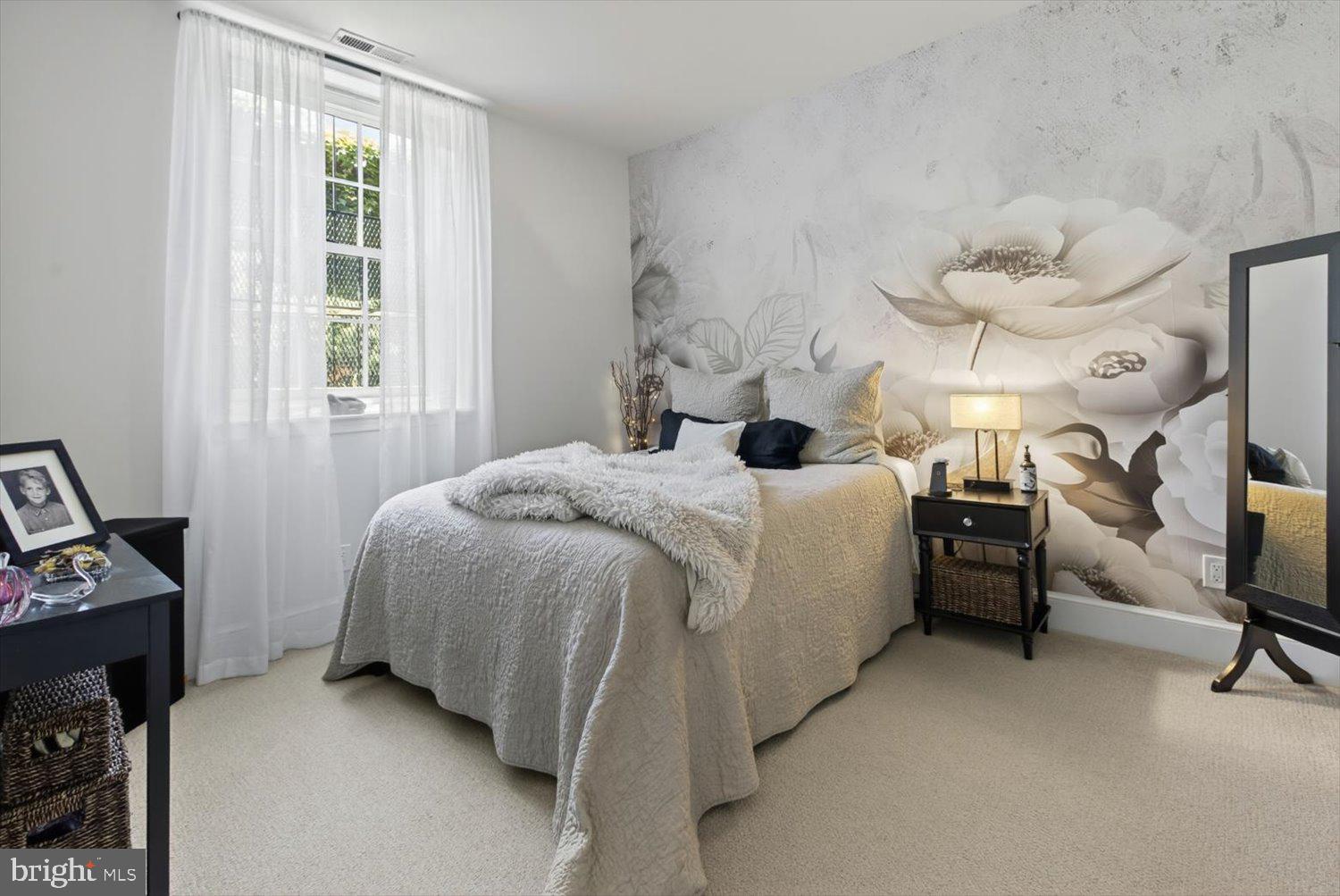 410 5th Street Northeast, Unit 1 Washington, DC 20002 - Photo 13 of 37 Serene bedroom with floral mural charm.