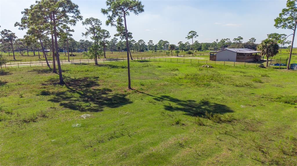 1075 Southwest Rucks Dairy Road Okeechobee, FL 34974 - Photo 18 of 65 a view of an outdoor space and yard